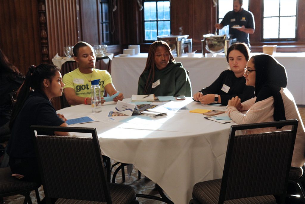 Students talking at a table