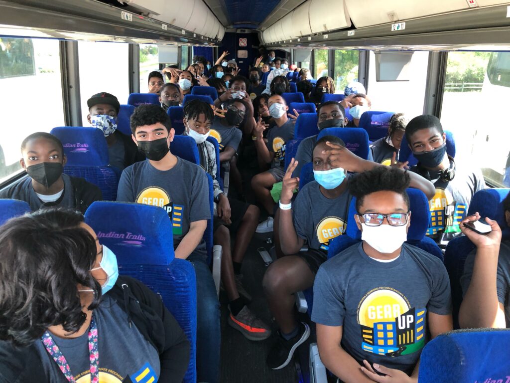 U-M AA GEAR UP students pose for a picture while sitting on a charter bus to Kings Island.