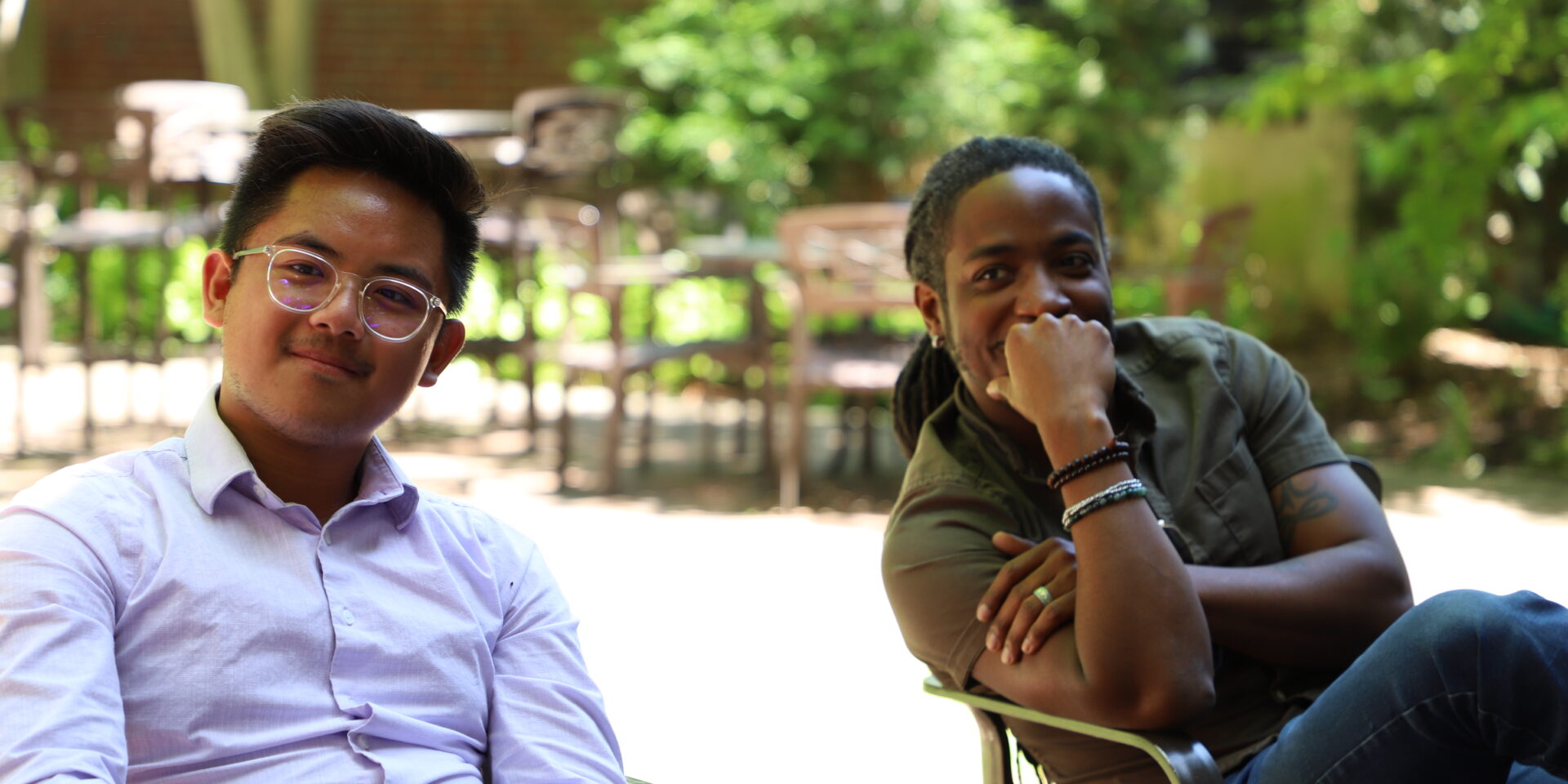 Michael sits next to an MCAC adviser and smiles for a picture.