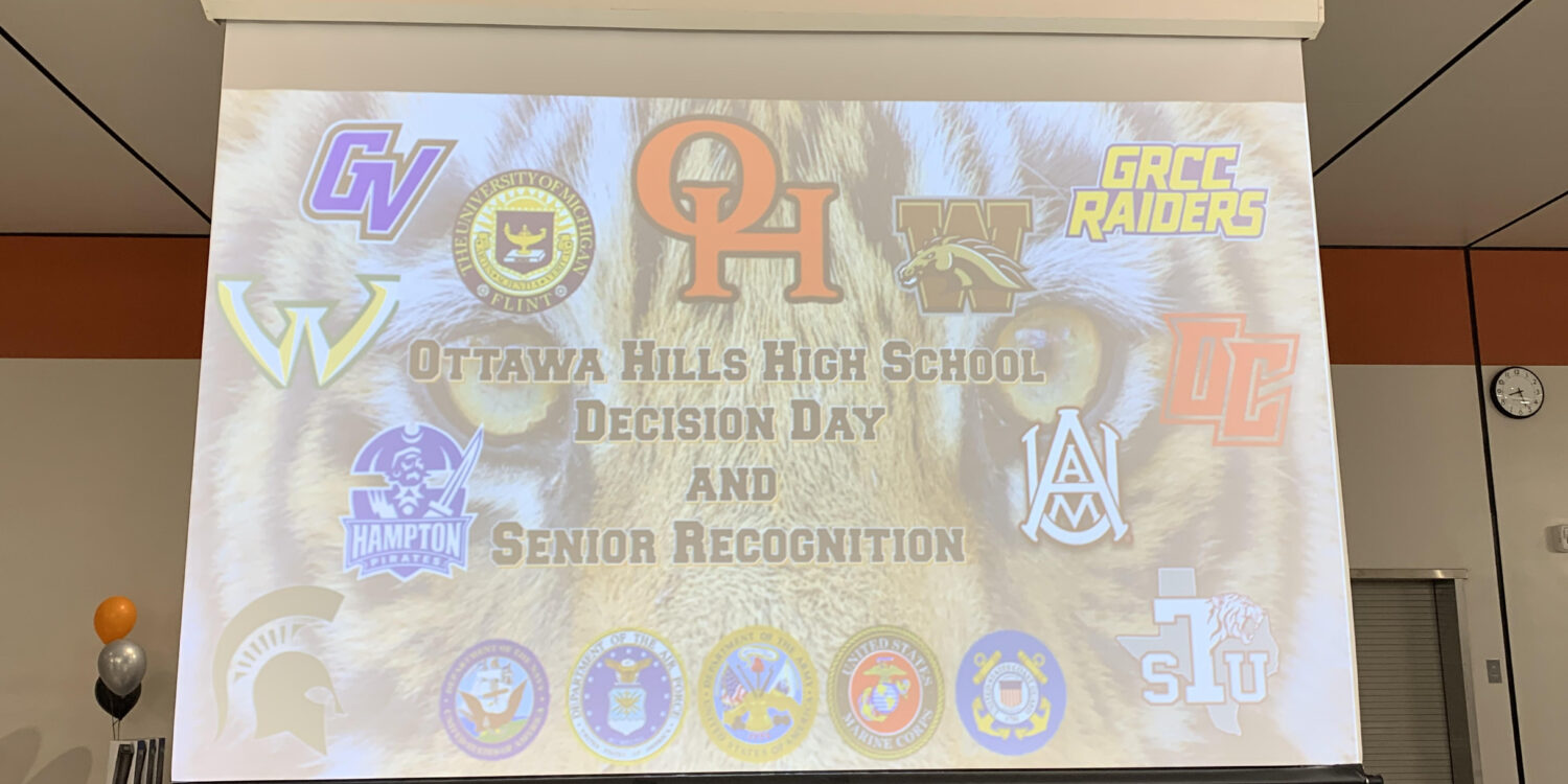 A projected image of an opening slide with the words "Ottawa Hills High School"