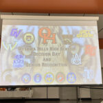 A projected image of an opening slide with the words "Ottawa Hills High School"